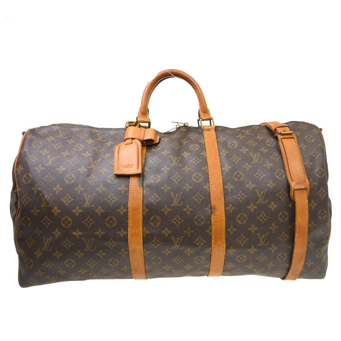 Louis Vuitton Monogram Keepall 60 Duffle Bag 23 in: Louis Vuitton Monogram Keepall 60 Duffle Bag 23 in This is a vintage Louis Vuitton Keepall Bandouliere 60 travel handbag, crafted from the iconic monogram canvas leather. Designed in an extra-large du
