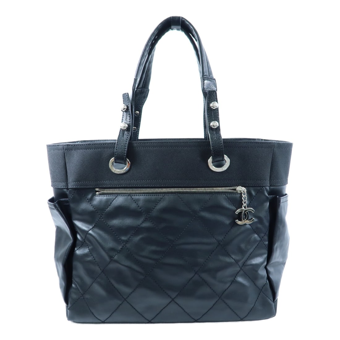 CHANEL Paris Biarritz Black Calfskin Nylon Tote Bag: CHANEL Paris Biarritz Black Calfskin Nylon Tote Bag This CHANEL Paris Biaritz tote bag features a stylish combination of black calfskin leather and nylon. Designed for women, the bag offers a spacious