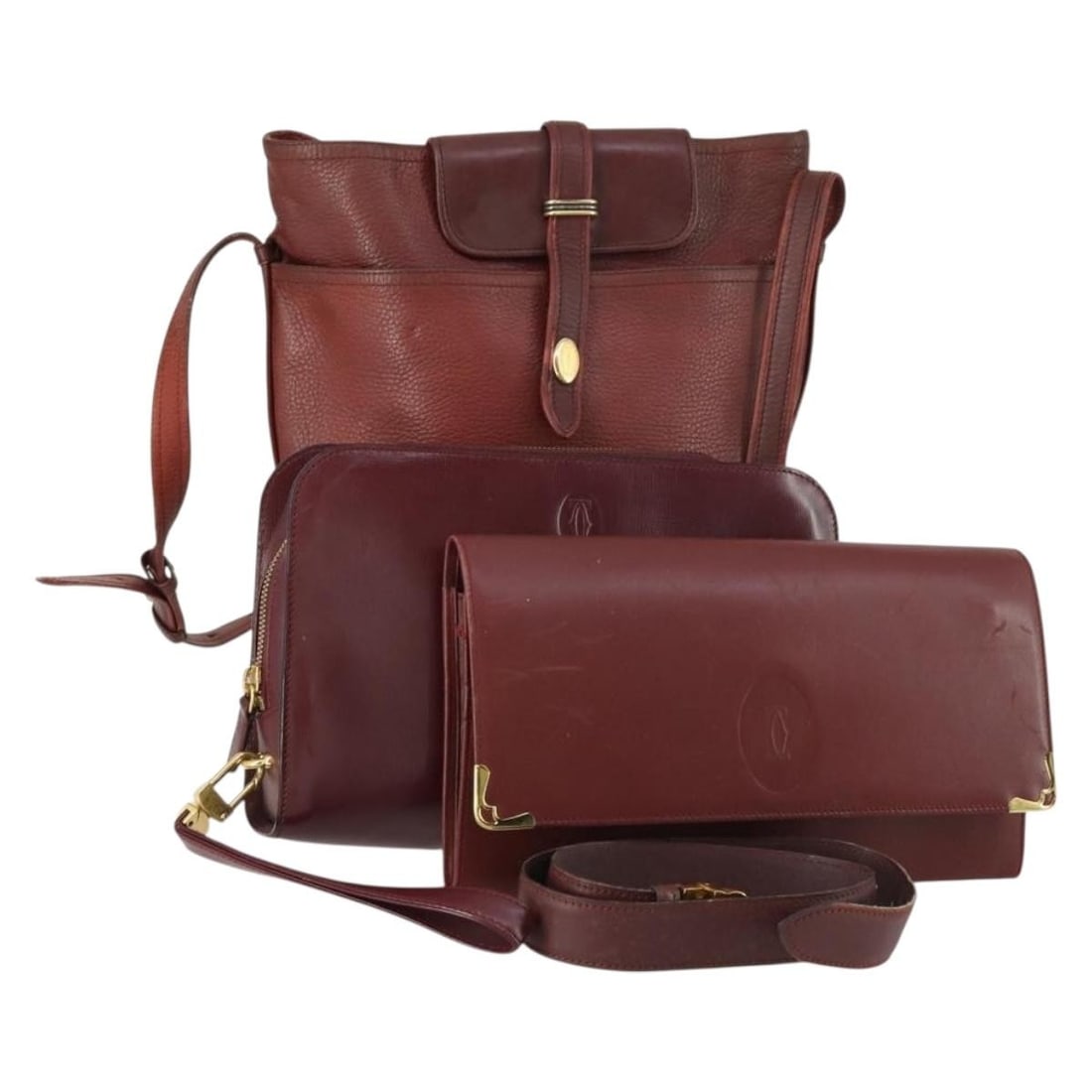 Cartier Must Line Bordeaux Leather Shoulder Bags Four Piece Collection: Cartier Must Line Bordeaux Leather Shoulder Bags Four Piece Collection This is a Cartier Must Line shoulder bag set crafted from leather in a bordeaux color. The leather has been repainted by a non-au