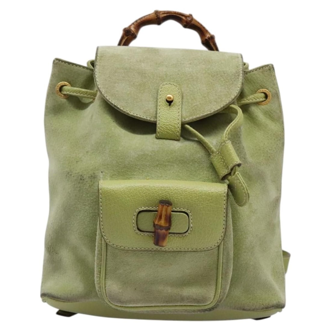 Green Suede Gucci Bamboo Backpack for Women Italy 20cm: Green Suede Gucci Bamboo Backpack for Women Italy 20cm This Gucci bamboo backpack features a green suede exterior and is designed for women. The bag is crafted in Italy and includes bamboo accents, a 