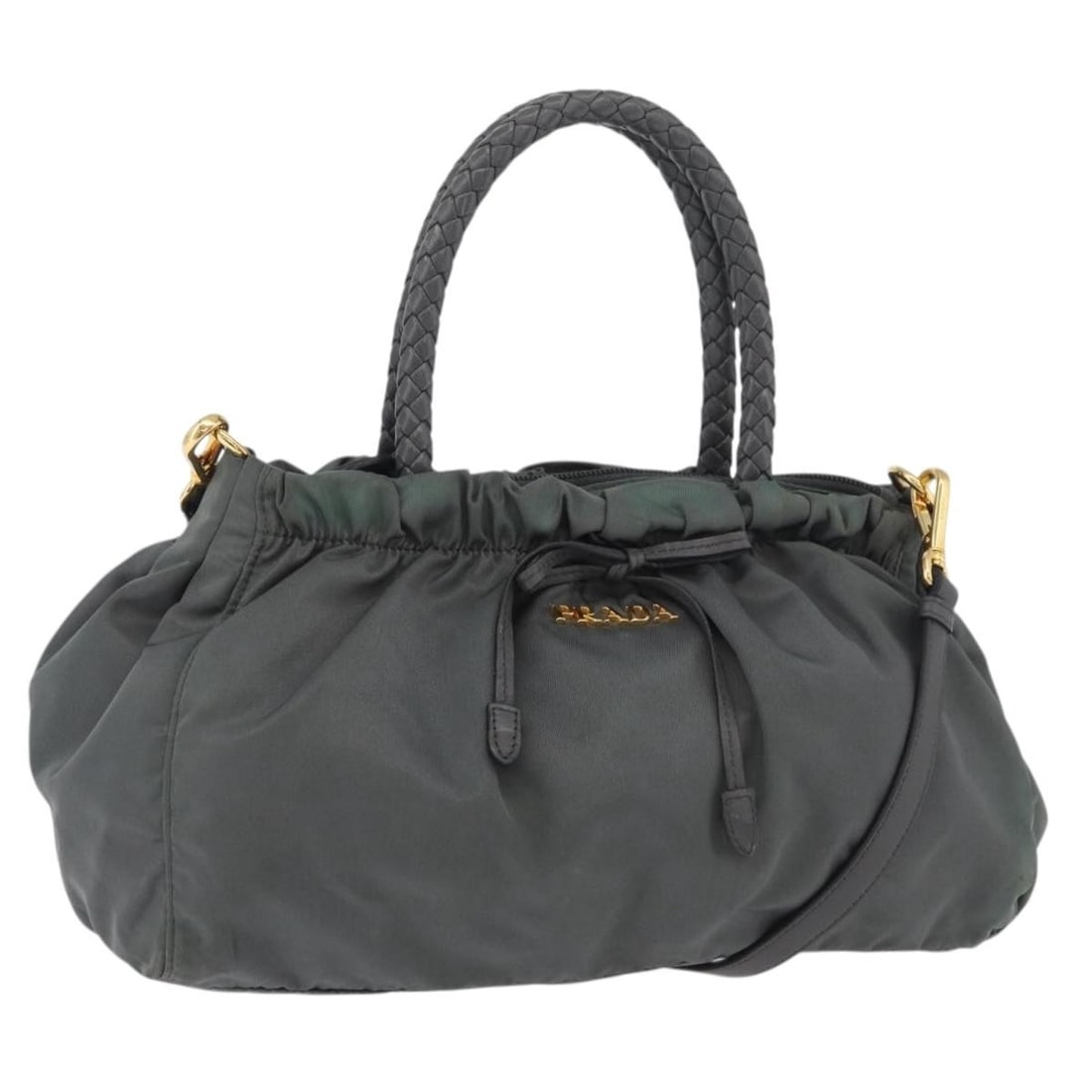 Prada Gray Nylon Handbag with Shoulder Strap Italy: Prada Gray Nylon Handbag with Shoulder Strap Italy This PRADA handbag offers versatile style with its 2-way design, crafted from durable nylon in a sophisticated gray and gold color combination. Desig