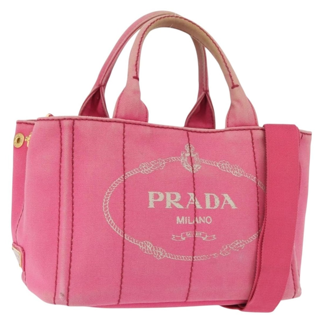 PRADA Mini Canvas Pink and Gold Two Way Handbag with Shoulder Strap: PRADA Mini Canvas Pink and Gold Two Way Handbag with Shoulder Strap This PRADA Canapa Mini hand bag offers versatile 2-way carrying options with its detachable shoulder strap and top handles. Crafted 