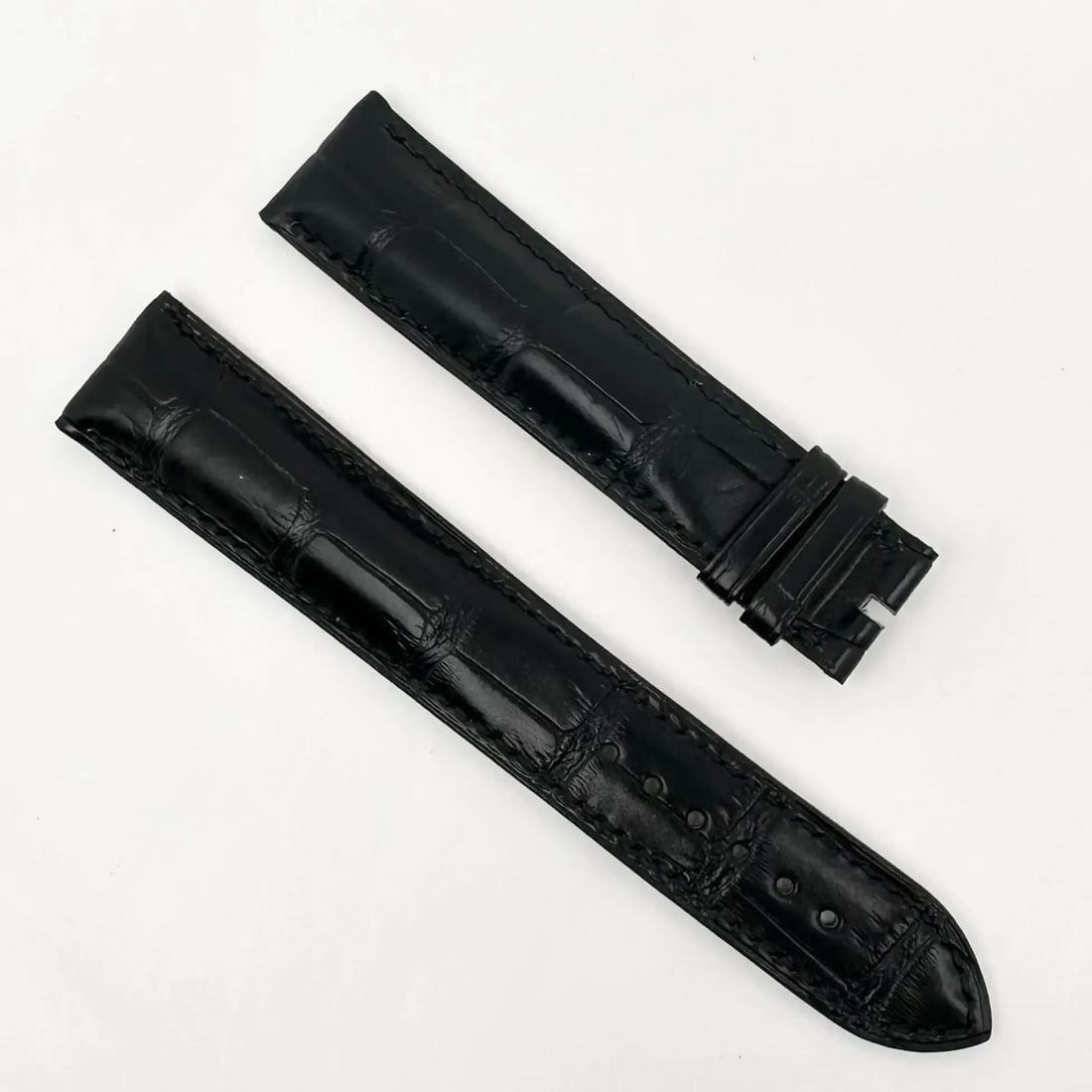 Bvlgari Black Alligator Leather Watch Strap 21mm x 18mm: Bvlgari Black Alligator Leather Watch Strap 21mm x 18mm Elevate your timepiece with this exquisite Bvlgari wristwatch band, crafted from luxurious black alligator leather. This two-piece strap is desi