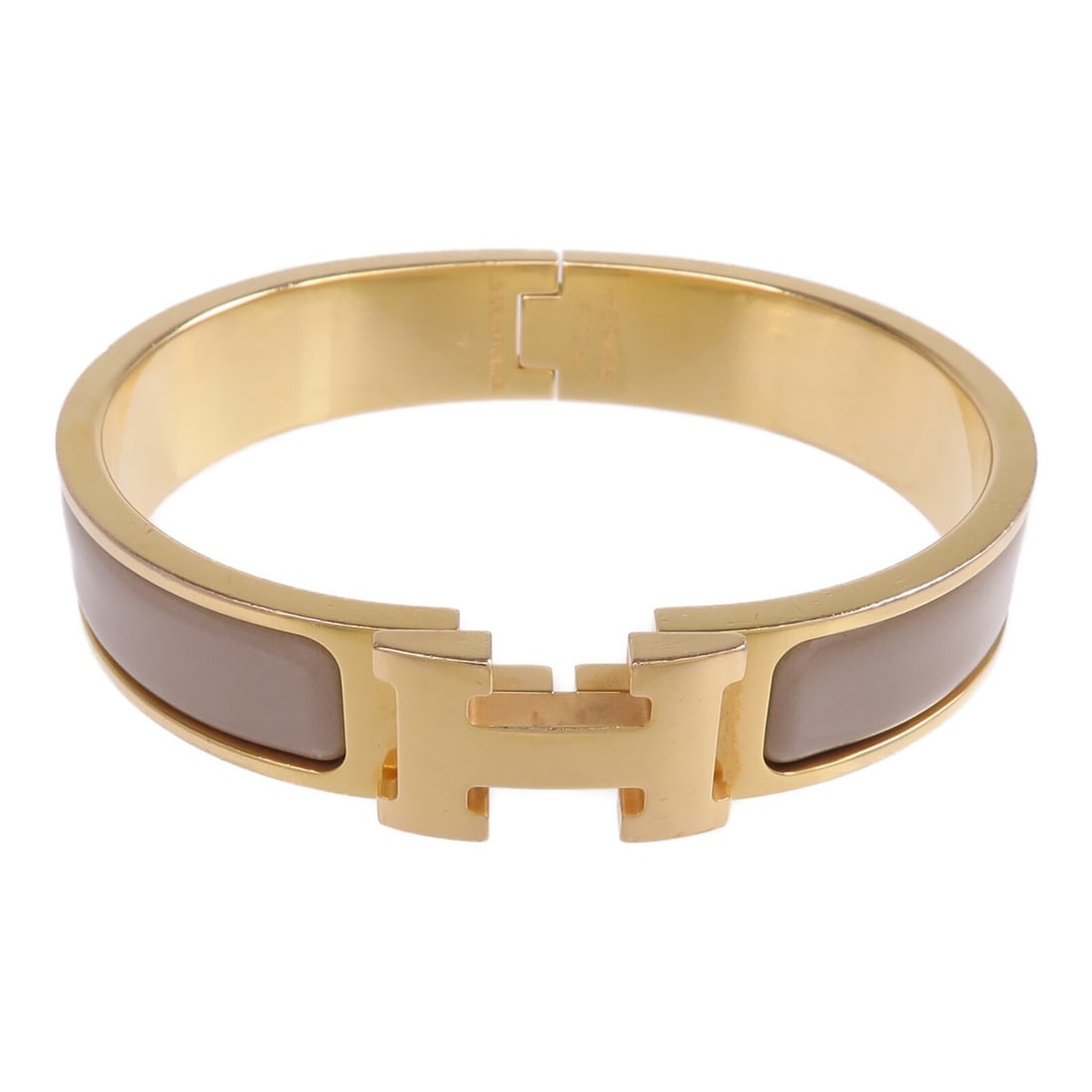 Hermes Clic H Enamel and Metal Beige Bangle Bracelet for Women: Hermes Clic H Enamel and Metal Beige Bangle Bracelet for Women This Hermes Clic H bracelet features a beige enamel exterior with gold-tone accents. Designed for women, it is crafted in France and show