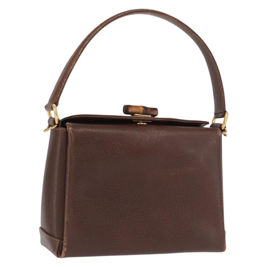 Brown Leather Bamboo Handle Gucci Handbag Gold Accents: Brown Leather Bamboo Handle Gucci Handbag Gold Accents This GUCCI Bamboo handbag features brown leather with gold-tone accents, crafted in Italy. The bag includes a distinctive bamboo handle and a com