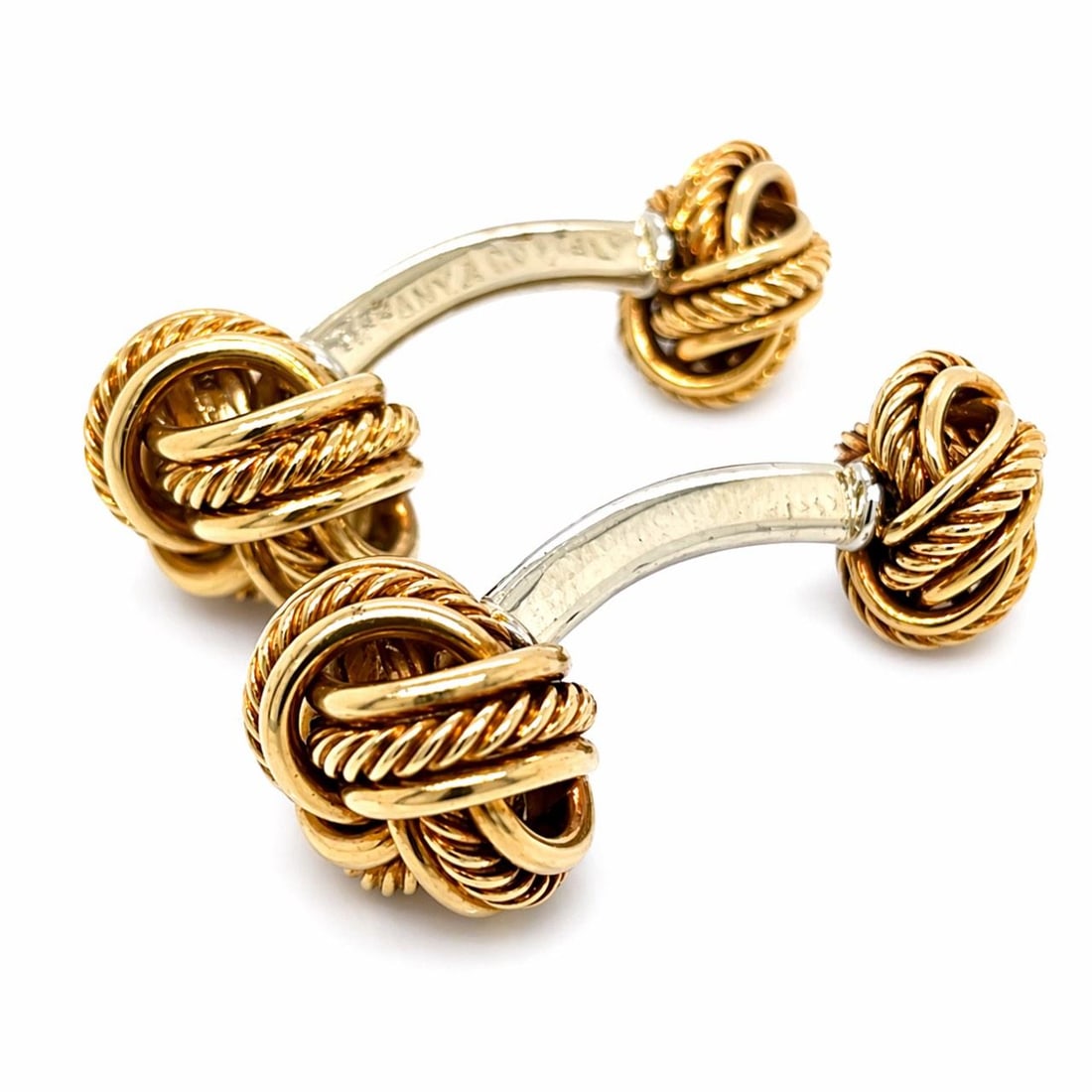 18K Yellow and White Gold Cufflinks by Tiffany and Co: 18K Yellow and White Gold Cufflinks by Tiffany and Co These Tiffany & Co. cufflinks are crafted from 18K yellow and white gold, offering a sophisticated and timeless accessory. The pair has a total we