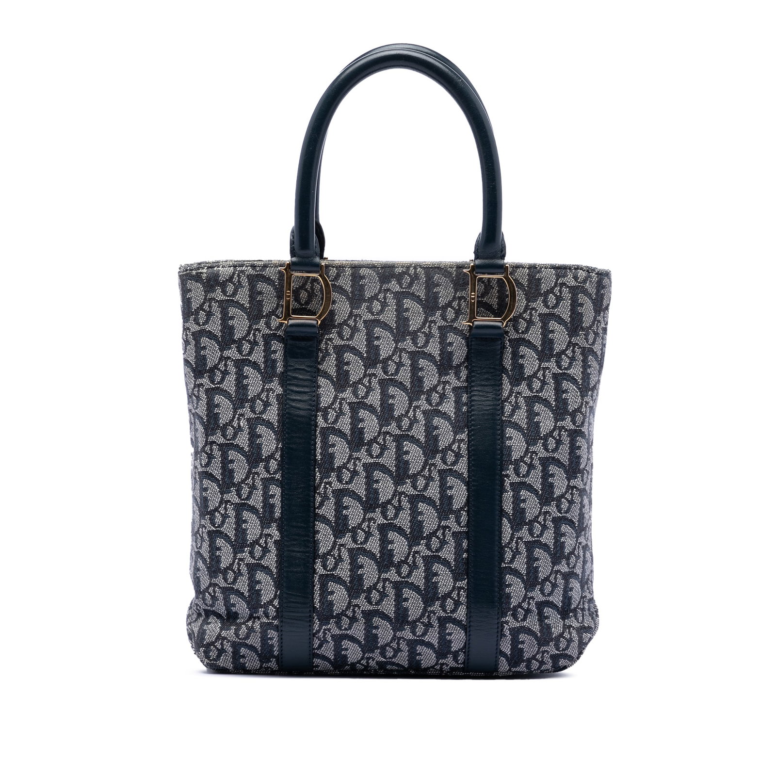 Blue Dior Diorissimo Trotter Canvas Tote with Leather Handles: Blue Dior Diorissimo Trotter Canvas Tote with Leather Handles This Diorissimo Trotter Canvas Tote features a blue canvas body with leather trim, rolled leather handles, an open top with magnetic snap 