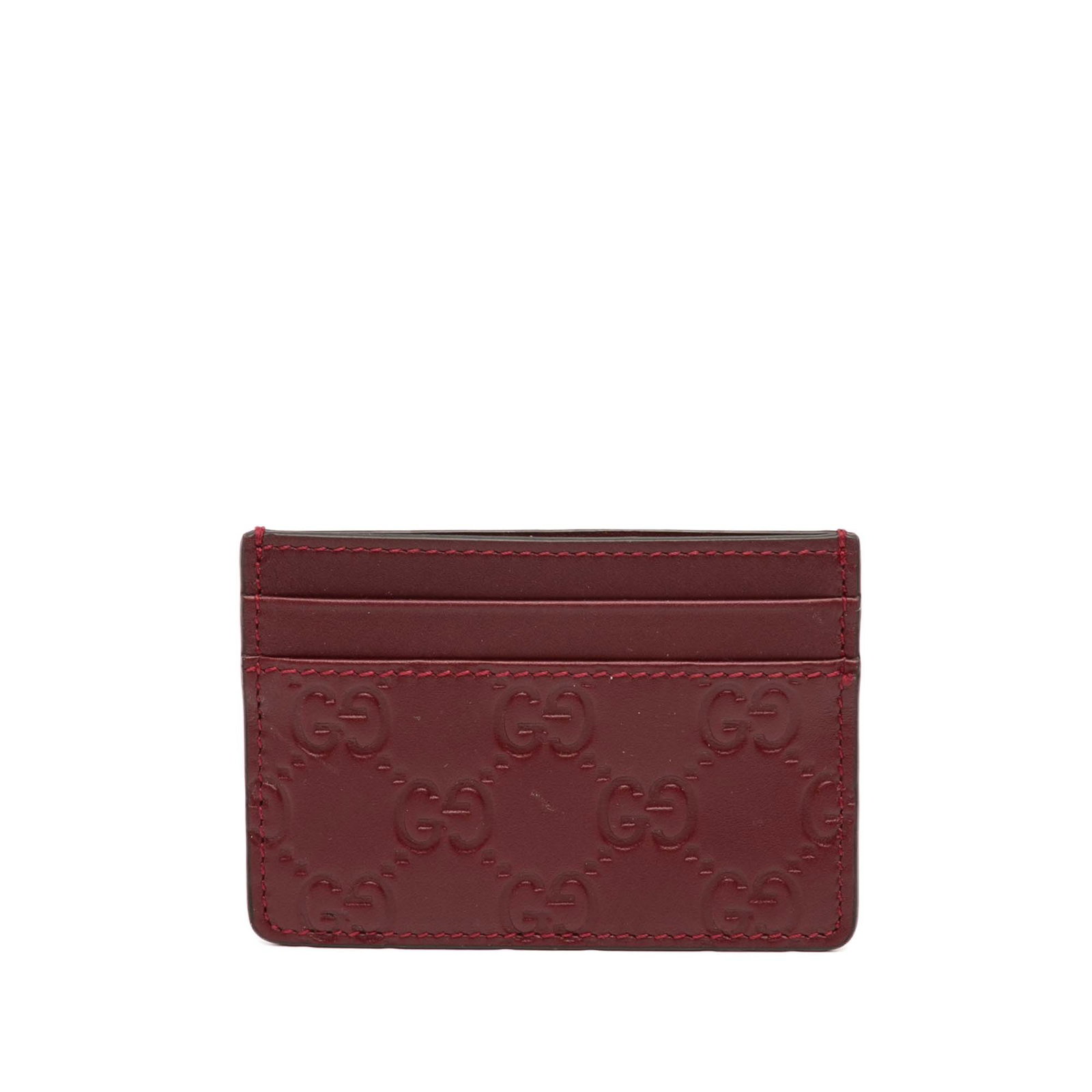 Gucci Red Leather Guccissima Embossed Card Holder Italy: Gucci Red Leather Guccissima Embossed Card Holder Italy This Guccissima card holder features an embossed leather exterior, an open top, and multiple exterior card slots. The item is crafted from leath