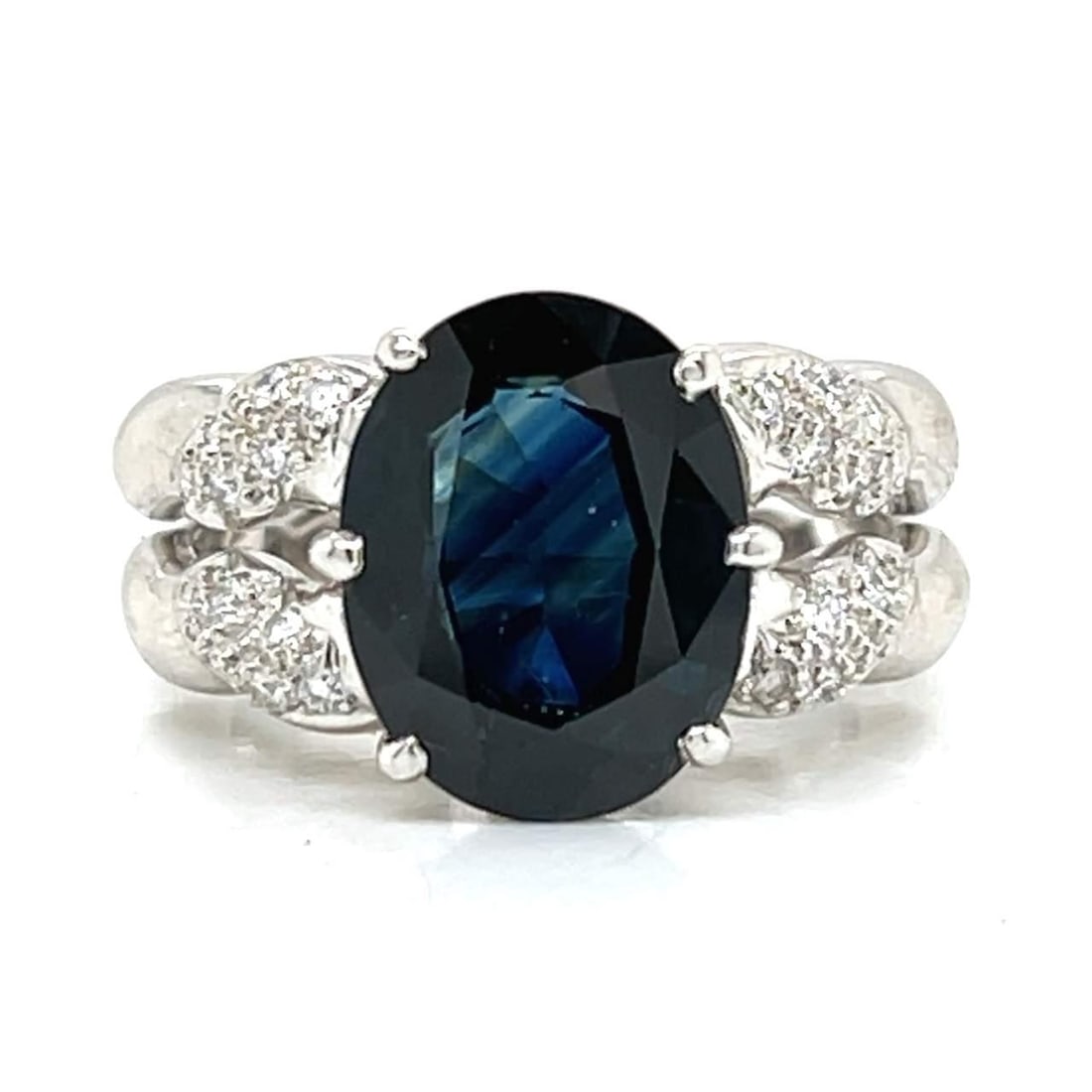 Platinum Sapphire 5.30 Ct Ring with 24 Diamonds F-G VVS-VS: Platinum Sapphire 5.30 Ct Ring with 24 Diamonds F-G VVS-VS This exquisite platinum ring features a stunning approximately 5.30 Ct. sapphire at its center, surrounded by 24 sparkling diamonds totaling 