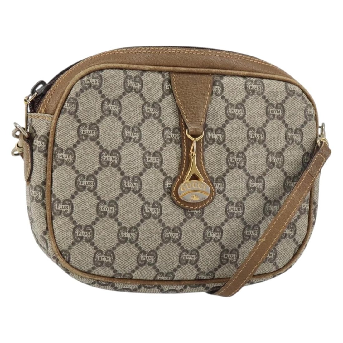 GUCCI GG Plus Supreme Beige Gold PVC Shoulder Bag Italy: GUCCI GG Plus Supreme Beige Gold PVC Shoulder Bag Italy This authentic GUCCI GG Plus Supreme Shoulder Bag is crafted from high-quality PVC leather in a sophisticated beige and gold colorway. The bag f
