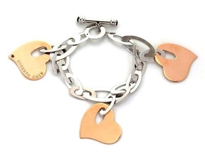 Roberto Coin 18k Rose White Gold Heart Charm Toggle Bracelet: Roberto Coin 18k Rose White Gold Heart Charm Toggle Bracelet This elegant bracelet features a chain design crafted from 18k rose and white gold, highlighted by a distinctive triple hearts charm. Made 