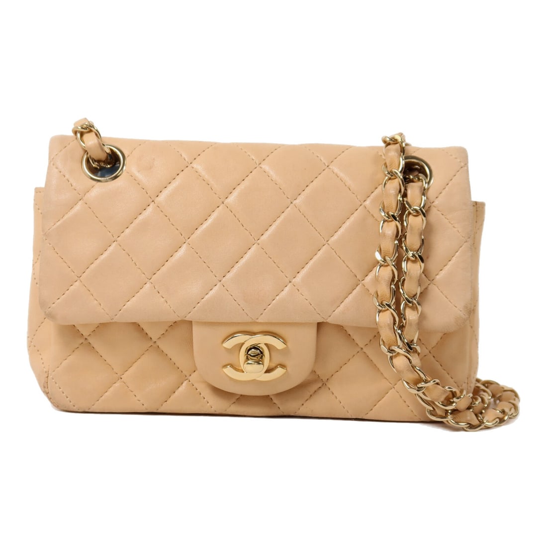 CHANEL Mini Classic 20 Beige Lambskin Shoulder Bag GHW: CHANEL Mini Classic 20 Beige Lambskin Shoulder Bag GHW This CHANEL Mini Classic 20 chain shoulder bag features a beige lambskin leather exterior and gold-tone hardware. Designed in a compact silhouett
