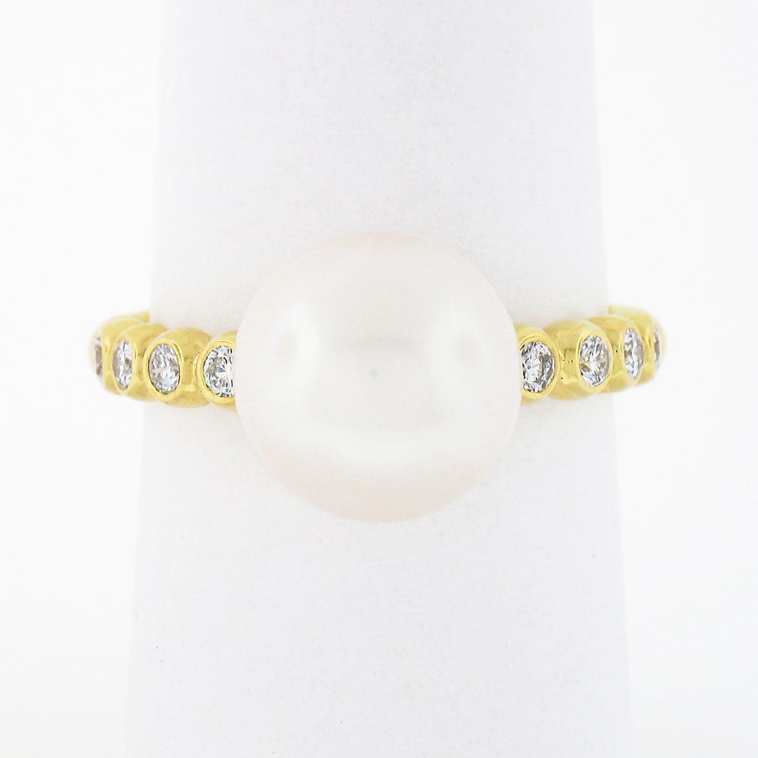 18k Yellow Gold 10.5mm Cultured Pearl Diamond Beaded Ring: 18k Yellow Gold 10.5mm Cultured Pearl Diamond Beaded Ring This exquisite ring features a stunning 10.50mm cultured pearl as its centerpiece, beautifully complemented by sparkling diamond accents. Craf