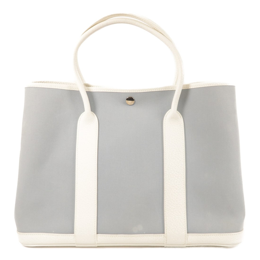 Hermes Garden Party PM Blue Canvas Tote with White Accents: Hermes Garden Party PM Blue Canvas Tote with White Accents This HERMES Garden Party PM tote bag features a canvas exterior in Bleu Zephyr and Blanc. Designed for women, it offers a spacious interior a