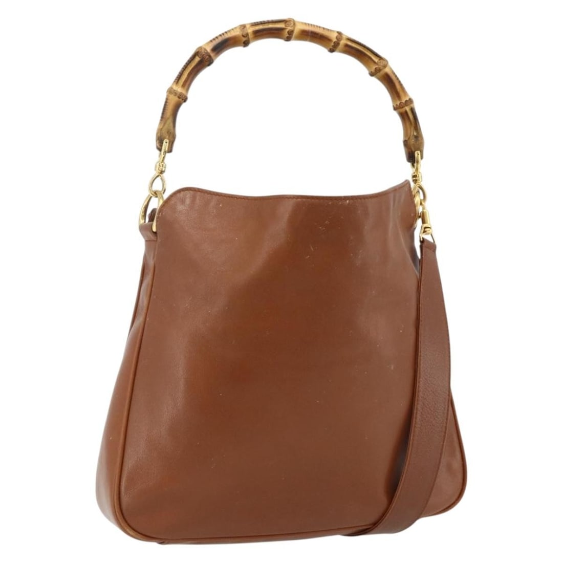 Gucci Bamboo leather two way brown gold shoulder bag 001 2113 1638: Gucci Bamboo leather two way brown gold shoulder bag 001 2113 1638 This GUCCI Bamboo Hand Bag is crafted from brown and gold leather and offers versatile carrying options with both top handles and a d