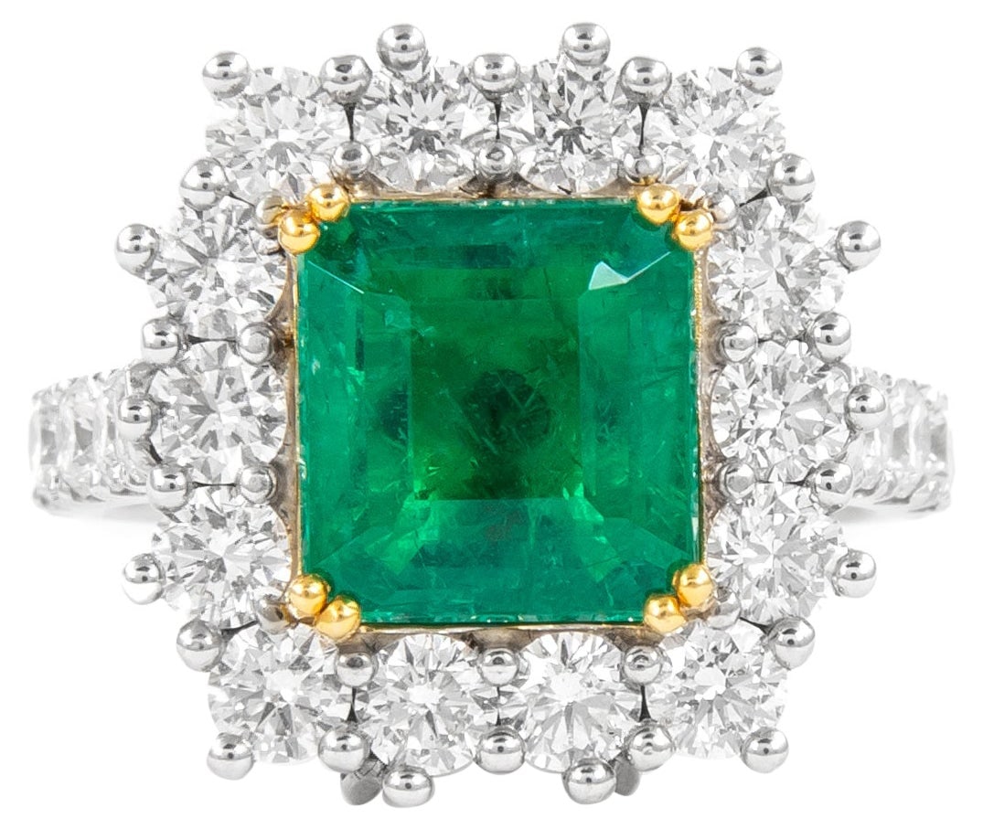 3.12ct GIA Emerald Diamond Halo Ring Pendant 18k: 3.12ct GIA Emerald Diamond Halo Ring Pendant 18k This exquisite GIA certified 3.12ct emerald ring features a stunning emerald cut stone set in an elegant diamond halo. The ring, which can also be conv