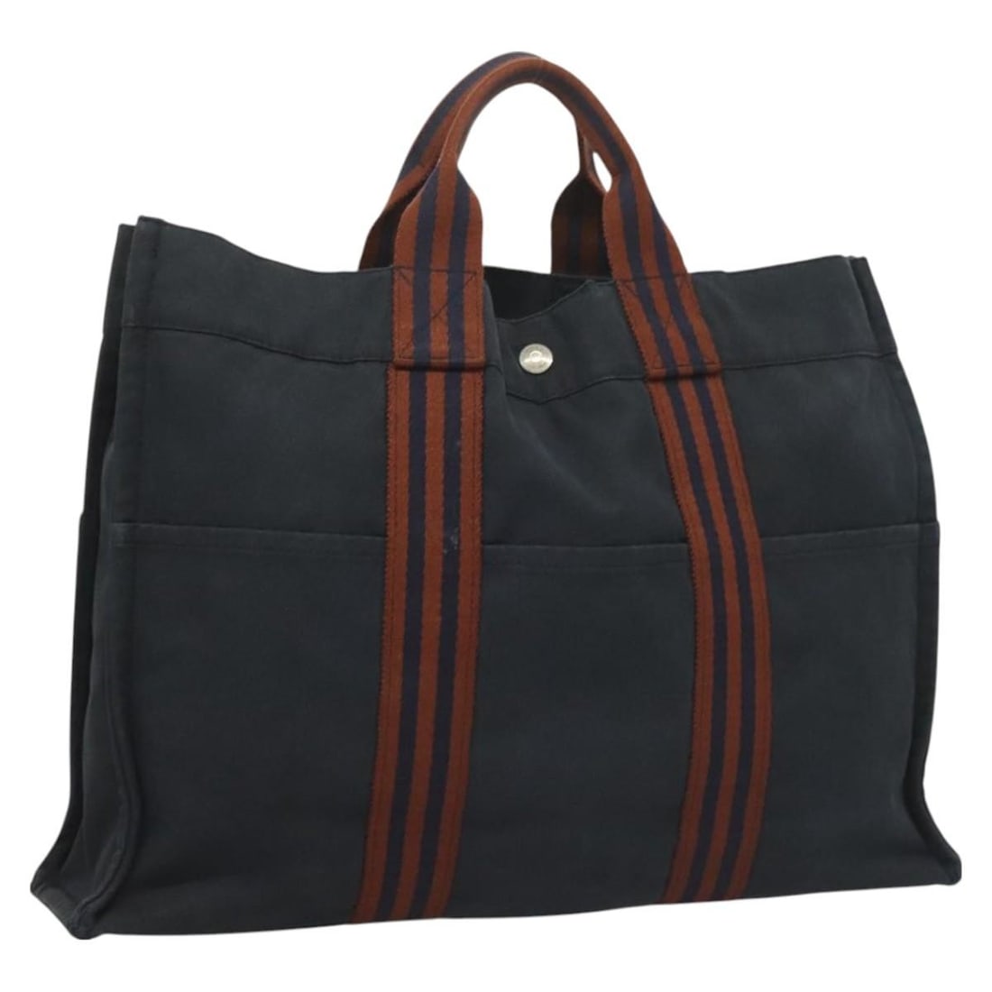HERMES Fourre Tout MM Navy Canvas Hand Bag Made in France: HERMES Fourre Tout MM Navy Canvas Hand Bag Made in France Introducing the HERMES Fourre Tout MM Hand Bag, a stylish and practical accessory designed for everyday use. This spacious hand bag showcases 