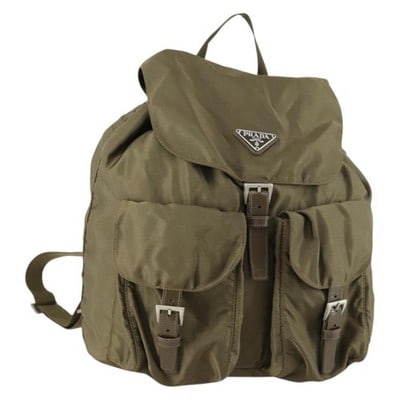 Prada Nylon Khaki Silver Backpack Italy: Prada Nylon Khaki Silver Backpack Italy This PRADA backpack features a khaki green nylon exterior accented with silver-tone hardware. Designed in a classic backpack style, it offers a spacious interio