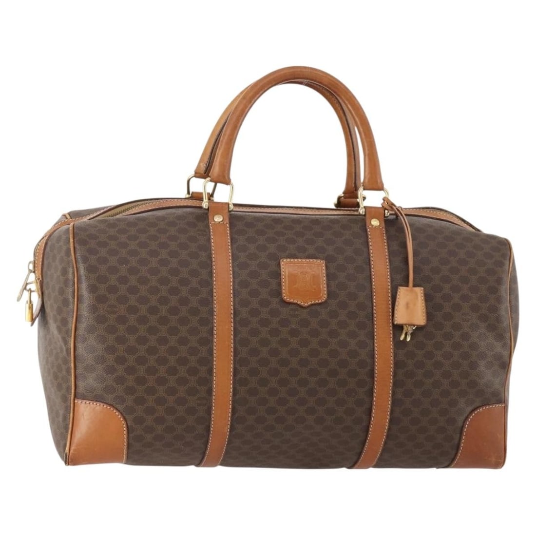 Celine Macadam Canvas Brown Boston Bag with Padlock and Keys: Celine Macadam Canvas Brown Boston Bag with Padlock and Keys This CELINE Boston bag features the signature Macadam canvas with brown and gold tones, complemented by PVC leather accents. Designed for w