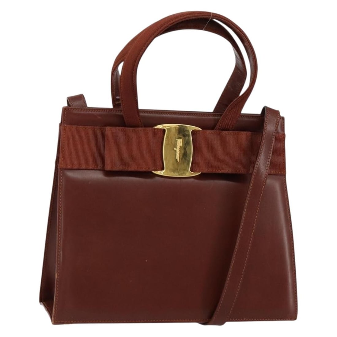 Salvatore Ferragamo Vala Hand Bag Leather Brown Gold 2way Italy: Salvatore Ferragamo Vala Hand Bag Leather Brown Gold 2way Italy This authentic Salvatore Ferragamo Vala Hand Bag is a luxurious accessory crafted in Italy. The bag features a sophisticated combination