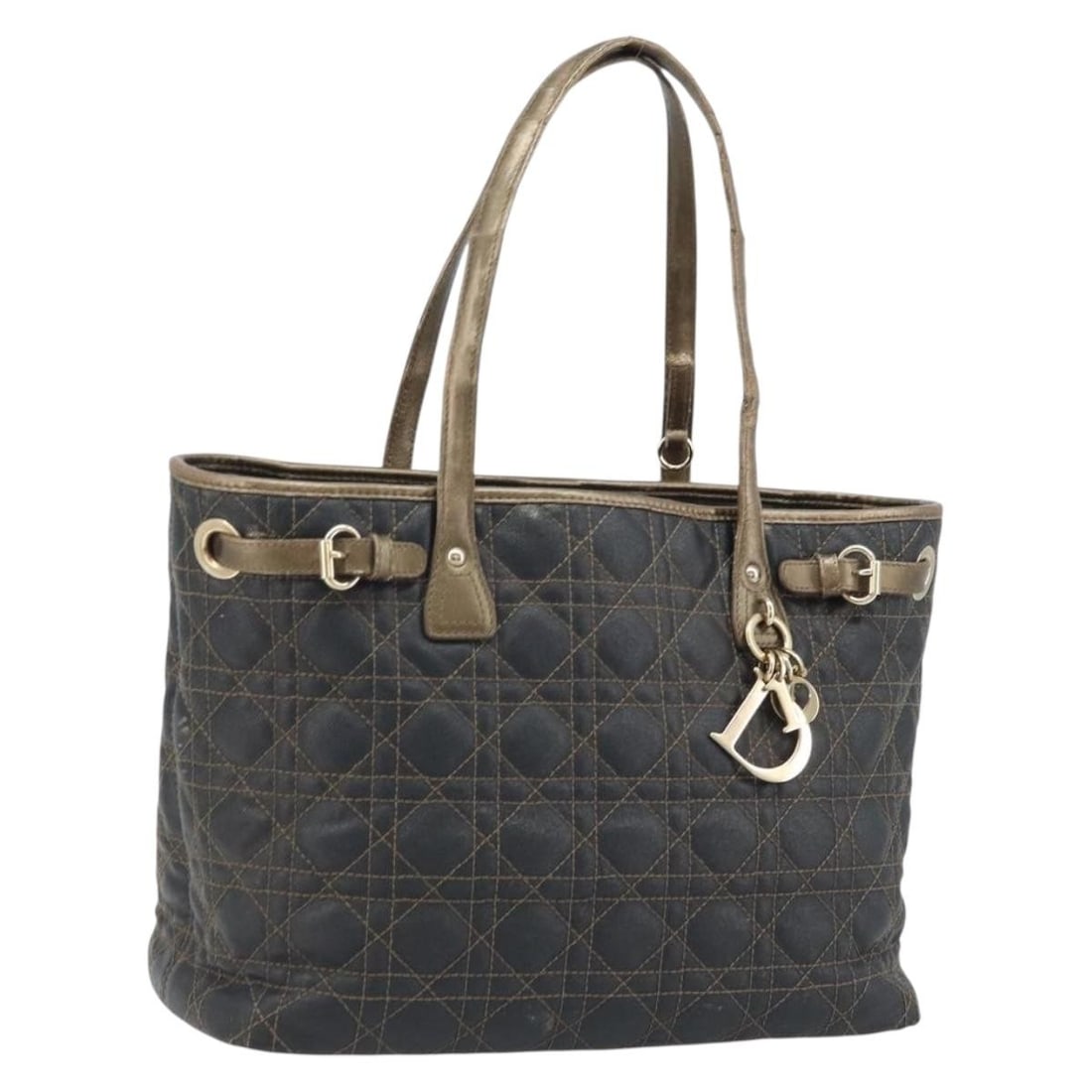 Christian Dior Cannage Black Coated Canvas Tote with Aftermarket Handle Repair: Christian Dior Cannage Black Coated Canvas Tote with Aftermarket Handle Repair This Christian Dior Canage tote bag is crafted from black coated canvas with gold accents. Designed for women, it feature