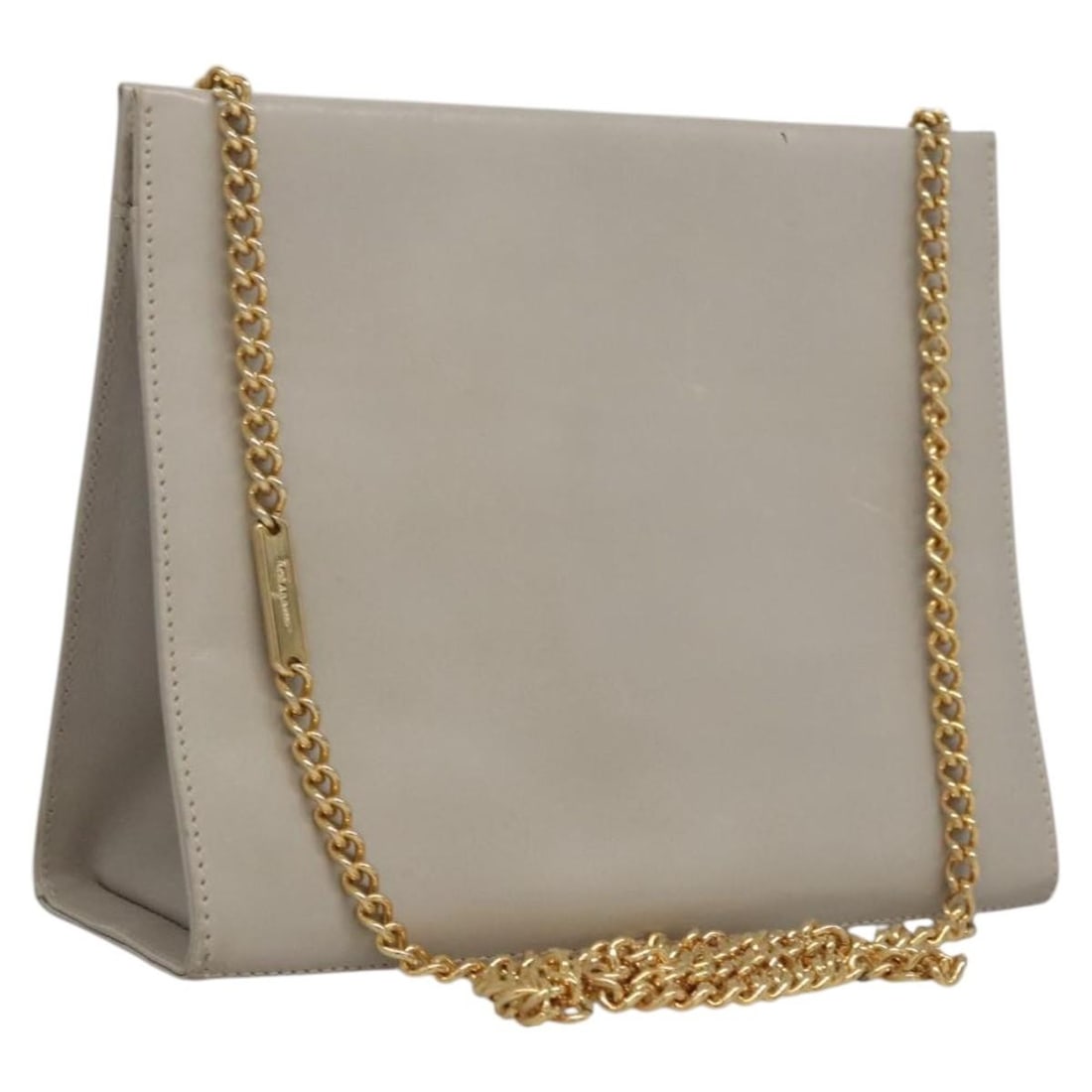 Beige Leather Chain Shoulder Purse by Salvatore Ferragamo Italy: Beige Leather Chain Shoulder Purse by Salvatore Ferragamo Italy This Salvatore Ferragamo shoulder bag features a beige and gold leather exterior, complemented by a chain shoulder strap. Designed for w