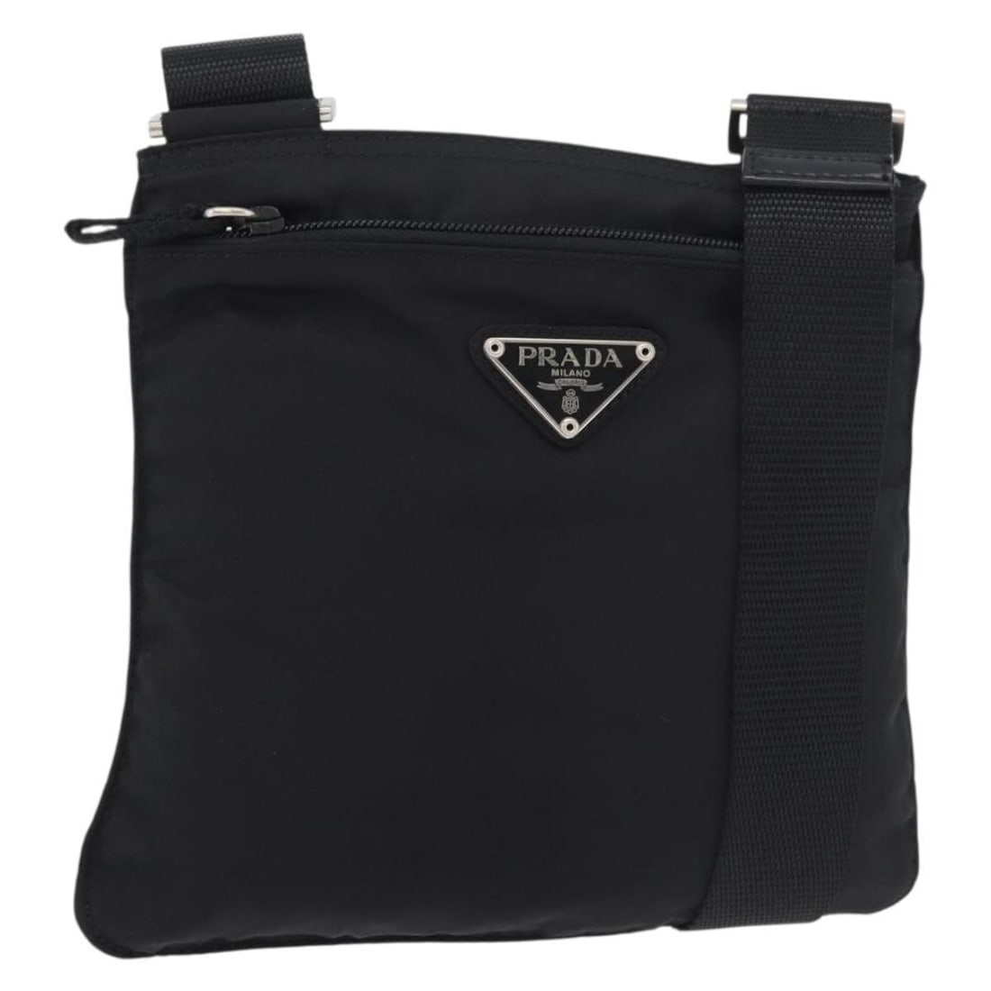 Prada black nylon women s shoulder bag Italy silver trim: Prada black nylon women s shoulder bag Italy silver trim This PRADA shoulder bag is crafted from durable black nylon with silver-tone accents. Designed for women, it features an adjustable shoulder st