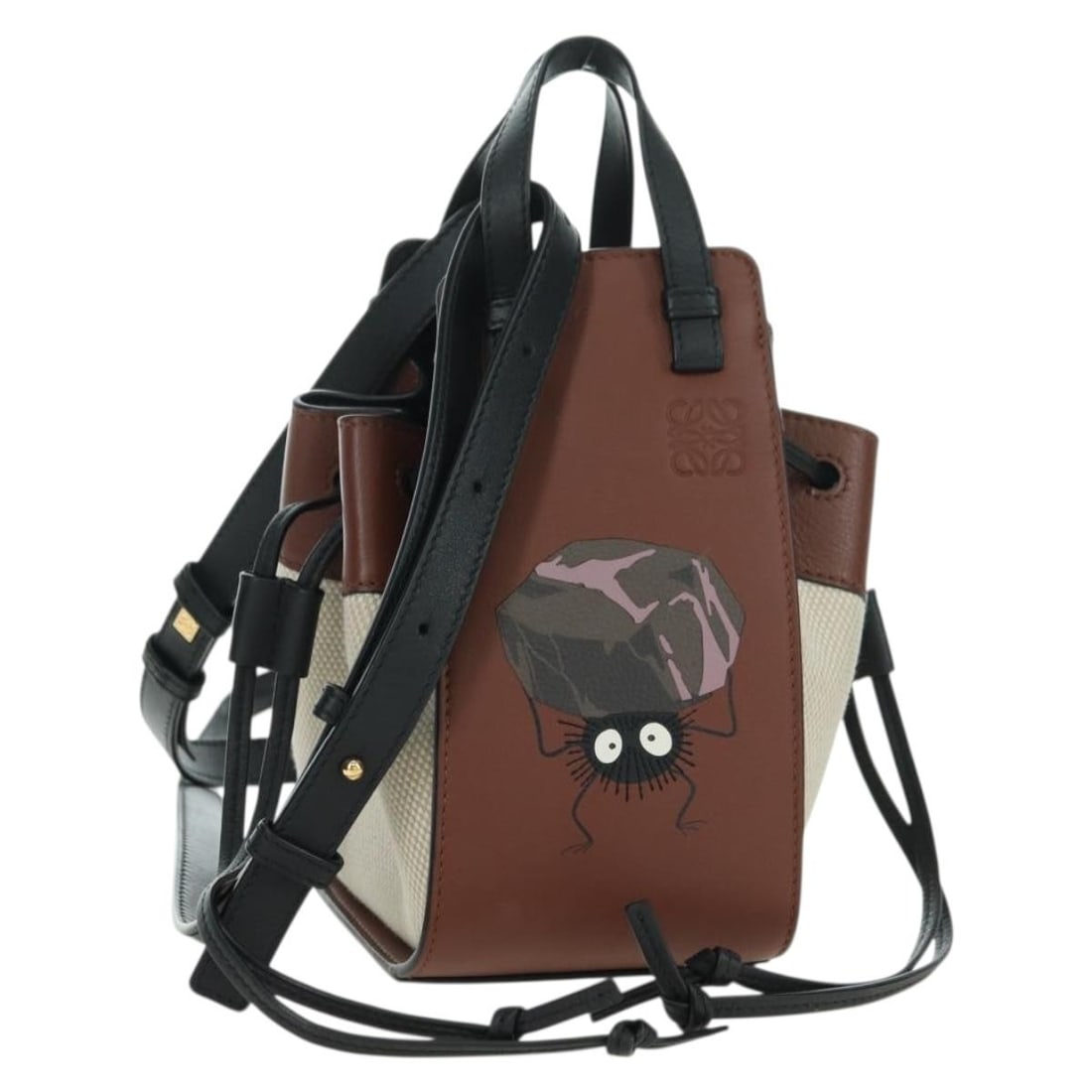 LOEWE Spirited Away Hammock Drawstring Soot Sprites Canvas Shoulder Bag: LOEWE Spirited Away Hammock Drawstring Soot Sprites Canvas Shoulder Bag This LOEWE x Ghibli Spirited Away Hammock Drawstring Bag features a charming Soot Sprites design, crafted from brown canvas. Des