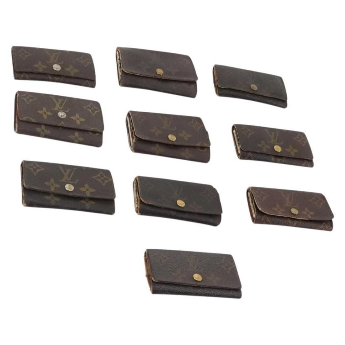 Louis Vuitton Monogram Canvas Key Case 10 Piece Set: Louis Vuitton Monogram Canvas Key Case 10 Piece Set This Louis Vuitton Monogram Key Case is crafted from signature monogram canvas and is designed for women. The case is heavily used and shows notable