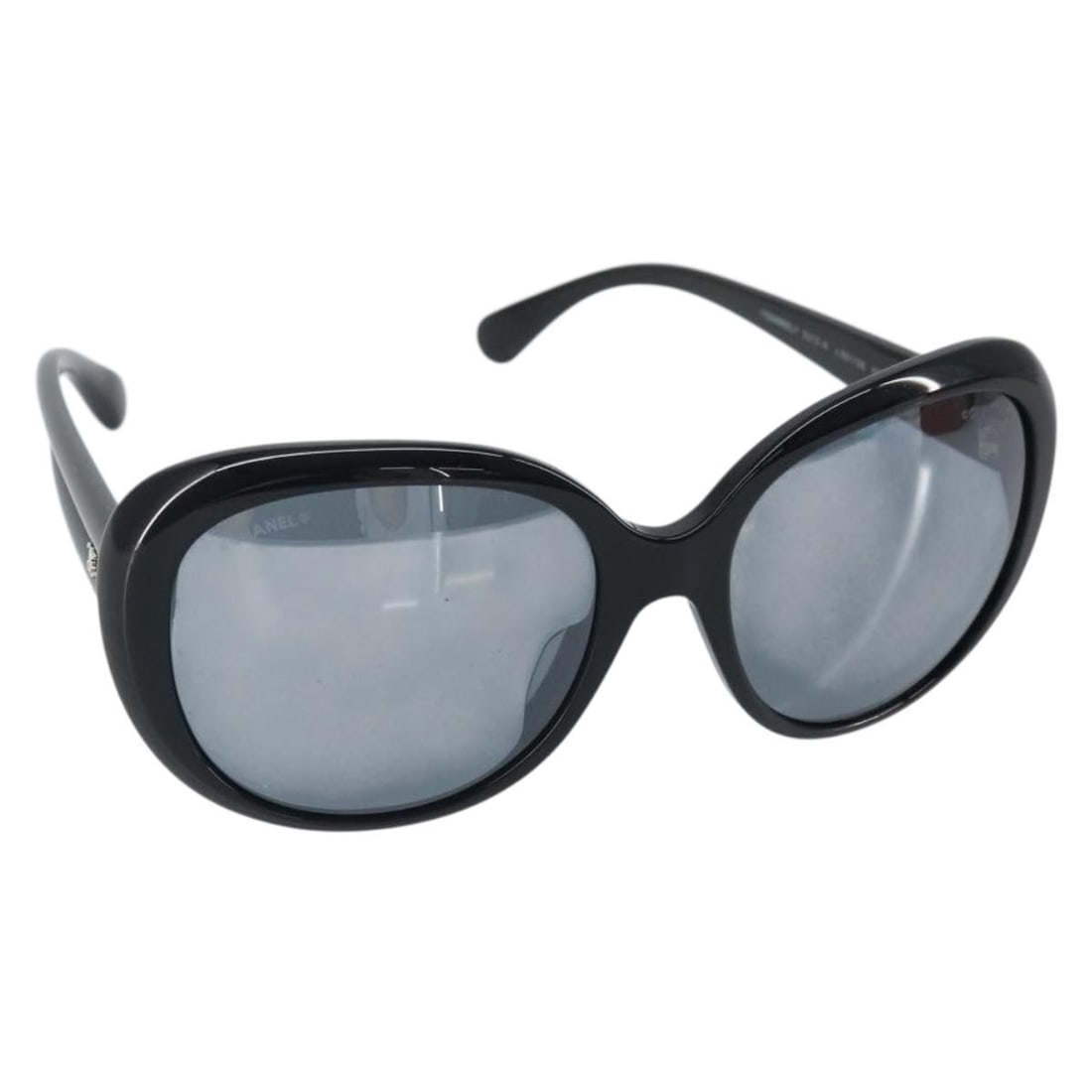 Black Plastic CHANEL 5718 Sunglasses Made in Italy: Black Plastic CHANEL 5718 Sunglasses Made in Italy These authentic CHANEL sunglasses feature a classic black plastic frame with the iconic CC logo. Made in Italy, they are designed for both style and 