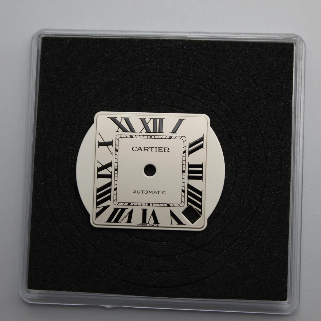 20mm Silvered Opaline Dial for Santos de Cartier Watch: 20mm Silvered Opaline Dial for Santos de Cartier Watch This is a pre-owned Cartier Santos de Cartier dial, featuring a silvered opaline finish and Roman numeral markers. Designed for women, this luxur
