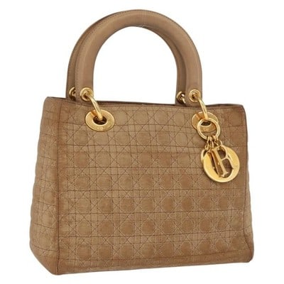 Christian Dior Cannage Nylon Brown Gold Handbag Charm: Christian Dior Cannage Nylon Brown Gold Handbag Charm This Christian Dior Canage hand bag features a brown and gold color scheme and is crafted from nylon. The bag includes a charm accessory and is ma