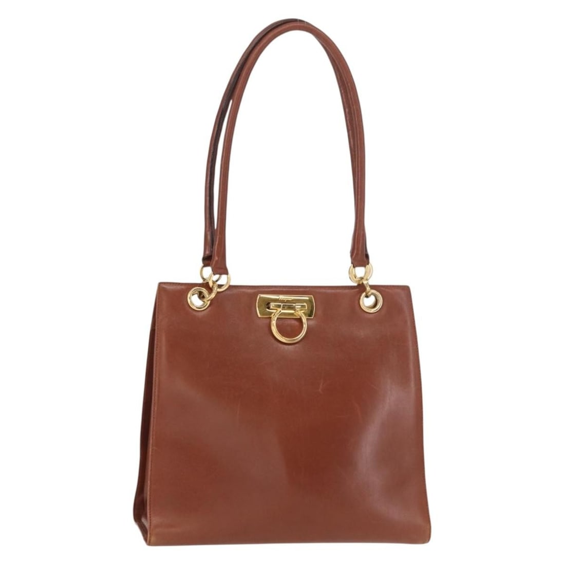 Salvatore Ferragamo Gancini Leather Hand Bag Brown Gold Italy Auth 153962: Salvatore Ferragamo Gancini Leather Hand Bag Brown Gold Italy Auth 153962 This stylish Salvatore Ferragamo Gancini Hand Bag showcases a luxurious leather exterior in a sophisticated brown and gold col