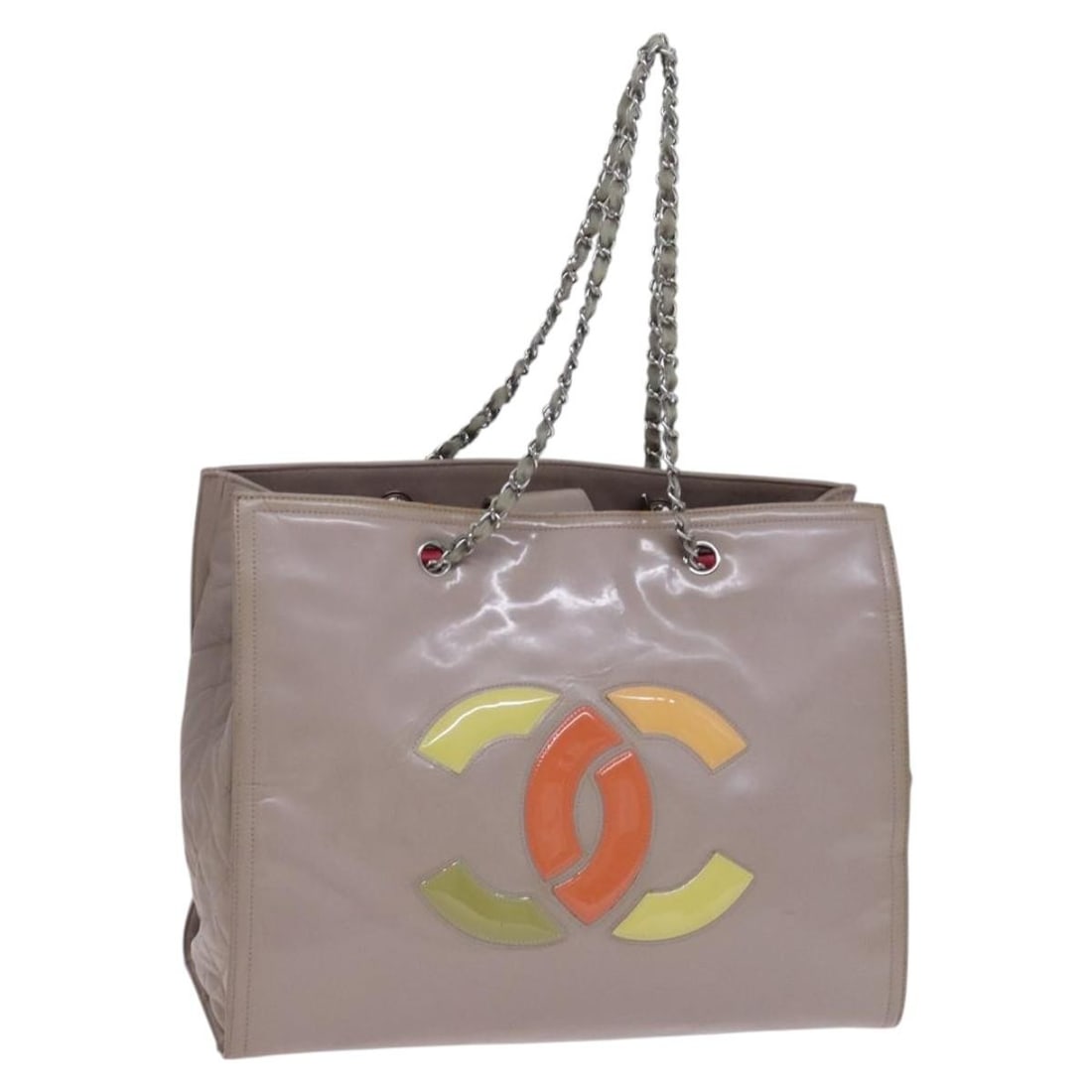 Beige Patent Leather Tote with Chain Handles by CHANEL: Beige Patent Leather Tote with Chain Handles by CHANEL This CHANEL tote bag is crafted from beige patent leather and features the iconic CC logo. Designed for women, it offers a spacious interior and 
