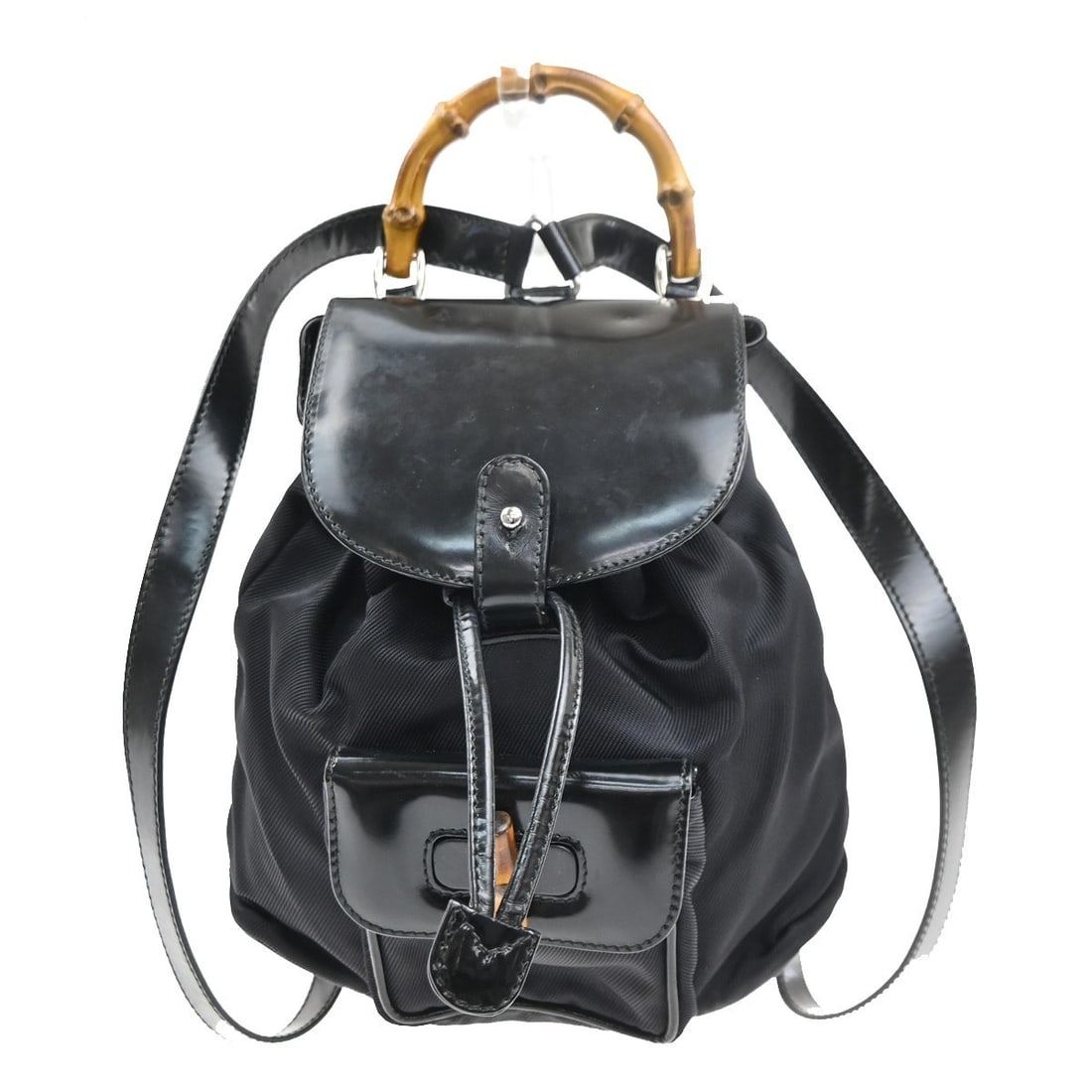 Gucci Black Nylon Patent Leather Vintage Bamboo Backpack Bag: Gucci Black Nylon Patent Leather Vintage Bamboo Backpack Bag This Gucci Vintage Bamboo Backpack features a stylish combination of black nylon and patent leather, designed for women. The backpack is ac