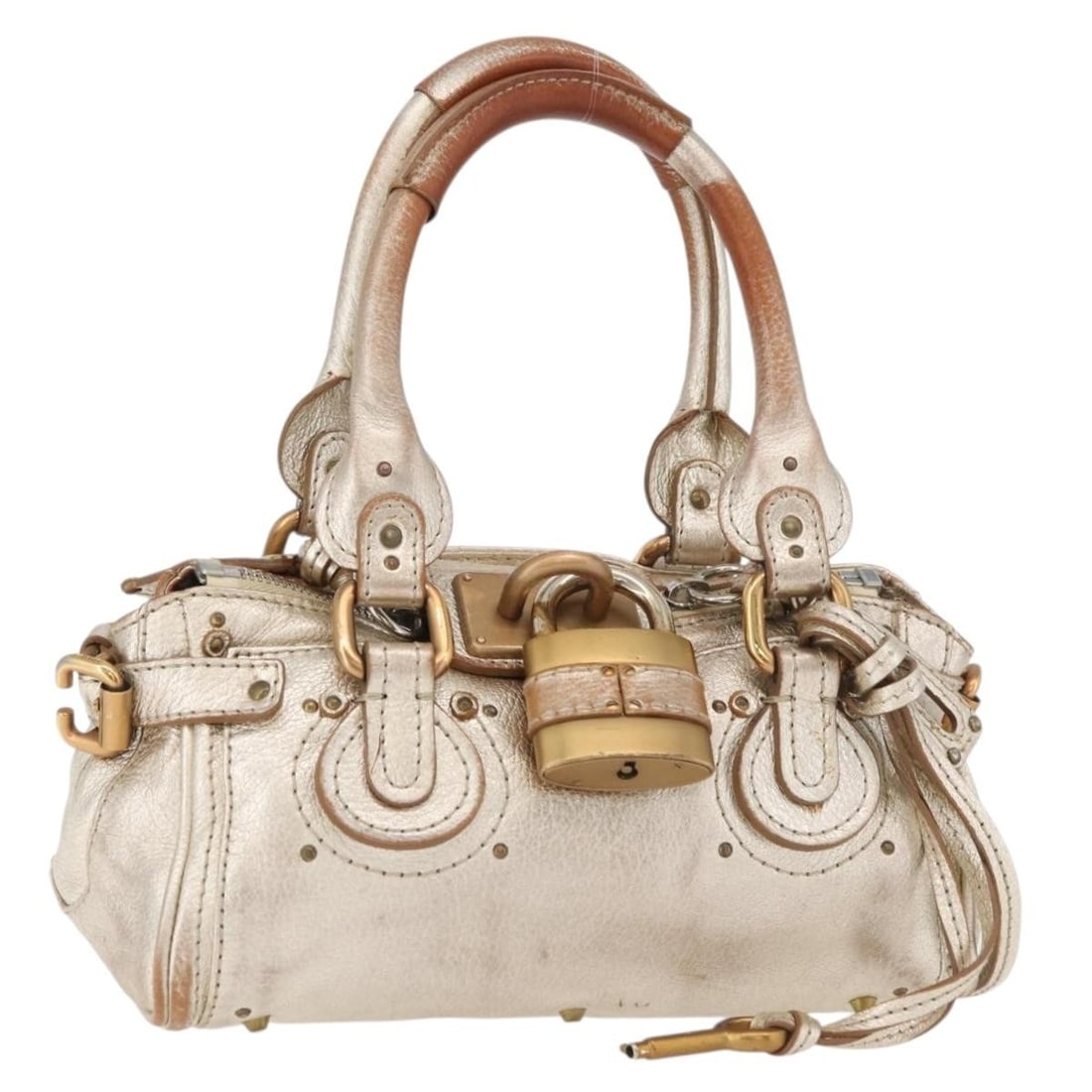 Chloe Paddington leather gold silver handbag Italy: Chloe Paddington leather gold silver handbag Italy This Chloe Paddington handbag is crafted from leather and features a gold and silver exterior. Designed for women, it offers a compact silhouette wit