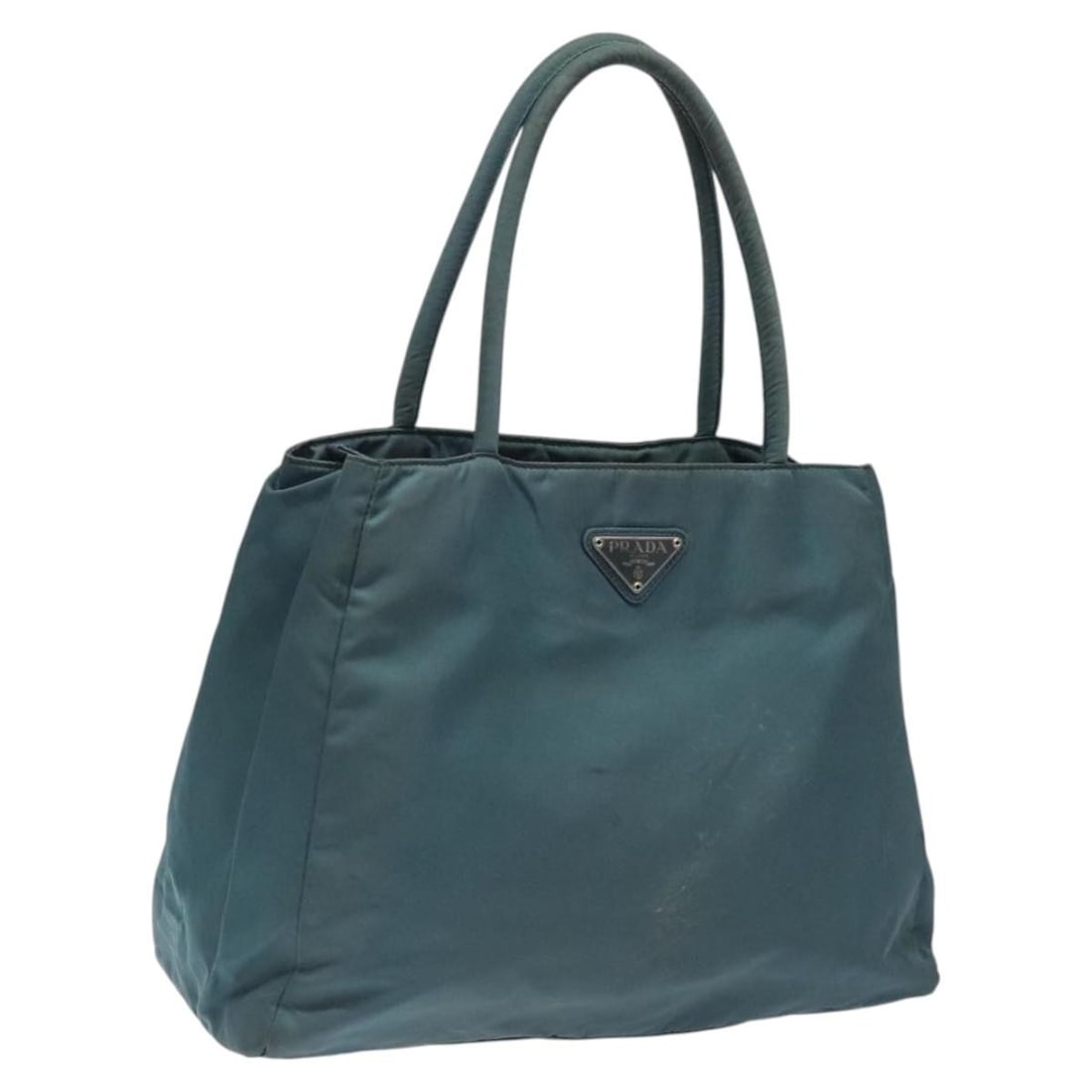 Prada Blue Silver Nylon Handbag Italy 12.2 Inch: Prada Blue Silver Nylon Handbag Italy 12.2 Inch This PRADA handbag features a blue and silver nylon exterior, offering a stylish and functional accessory for everyday use. Designed for women, the bag 