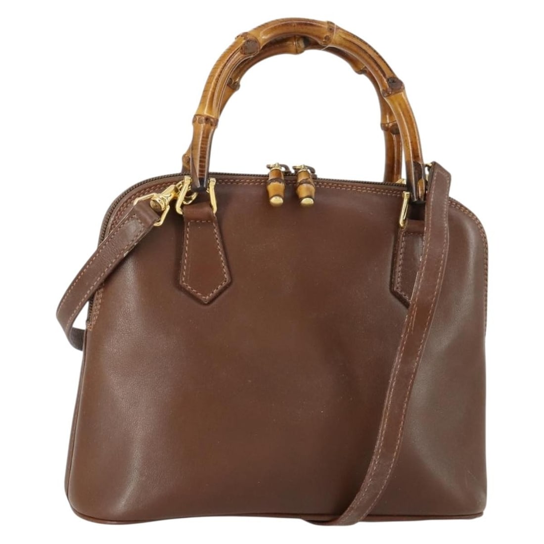 Brown Leather Bamboo Handle 2way Handbag with Strap by Gucci Model 000 2865 0290: Brown Leather Bamboo Handle 2way Handbag with Strap by Gucci Model 000 2865 0290 This GUCCI Bamboo 2-way handbag features a versatile design in brown leather with gold accents. The bag includes both a