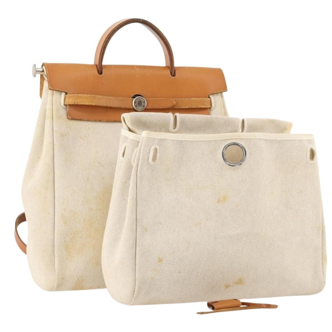 Herbag Ad PM Canvas and Leather 2way Backpack Beige Silver with Padlock Key: Herbag Ad PM Canvas and Leather 2way Backpack Beige Silver with Padlock Key This Hermes Herbag Ad PM is a 2-way backpack crafted from beige canvas with leather accents and silver-tone hardware. Design