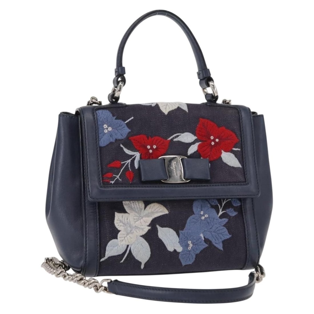 Navy Denim Salvatore Ferragamo Vala Leather Handbag: Navy Denim Salvatore Ferragamo Vala Leather Handbag This Salvatore Ferragamo Vala handbag for women features navy denim material with leather accents. The pre-owned bag is in very good condition with 