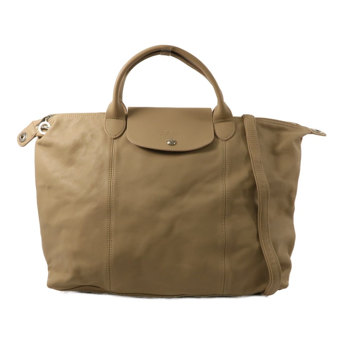 Longchamp Beige Lambskin 2 Way Shoulder Bag 1087236: Longchamp Beige Lambskin 2 Way Shoulder Bag 1087236 This Longchamp 2-way shoulder bag is crafted from beige lambskin leather, offering a soft and luxurious feel. Designed for versatility, it can be ca