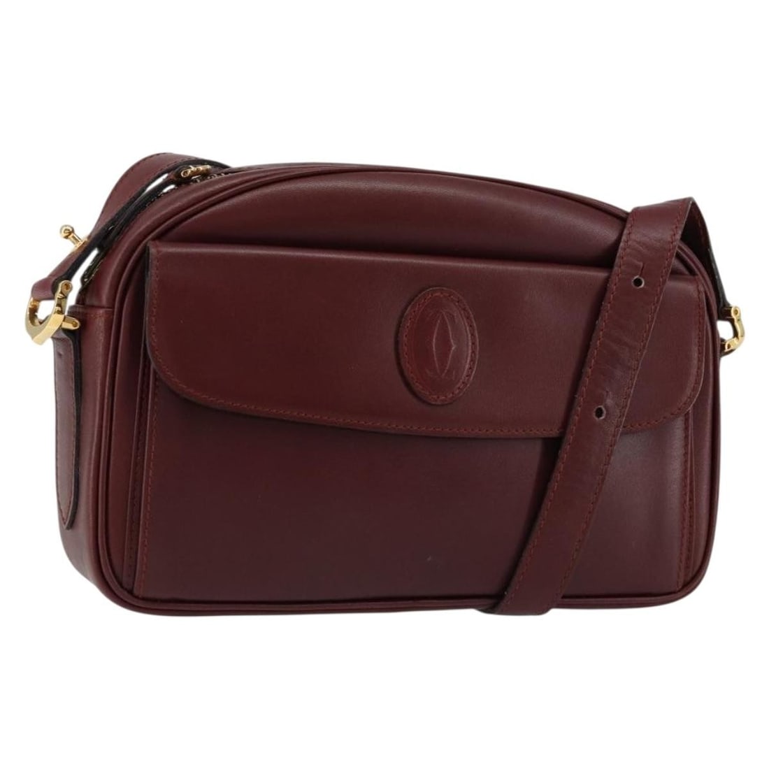 CARTIER Must Line Bordeaux Gold Leather Shoulder Bag: CARTIER Must Line Bordeaux Gold Leather Shoulder Bag This elegant CARTIER Must Line Shoulder Bag is crafted from luxurious leather in a rich Bordeaux color with gold accents. Designed for both style a