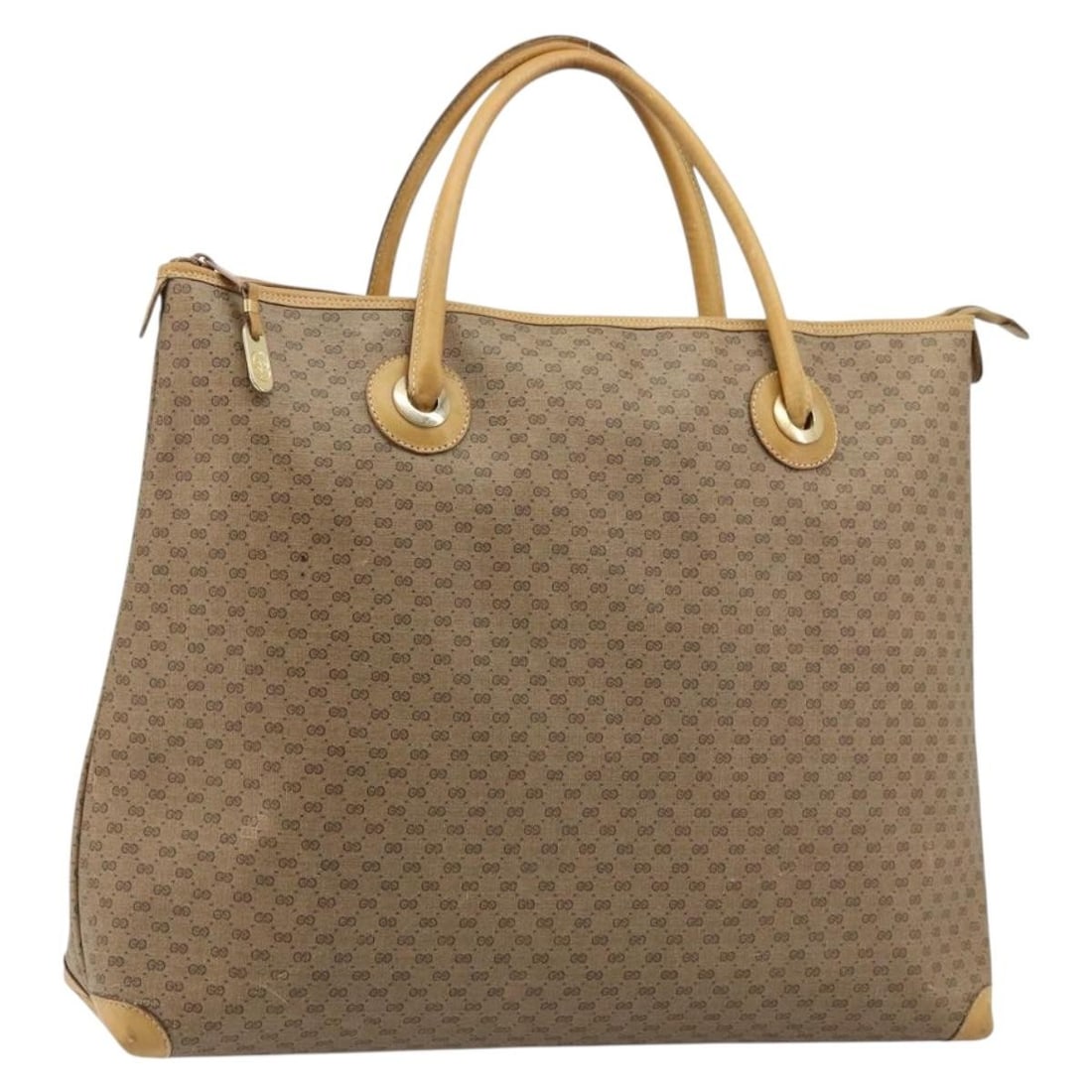 Gucci Micro GG Supreme beige gold PVC leather tote bag: Gucci Micro GG Supreme beige gold PVC leather tote bag This Gucci Micro GG Supreme tote bag features a beige and gold exterior crafted from PVC leather and micro small GG canvas. The spacious tote is 