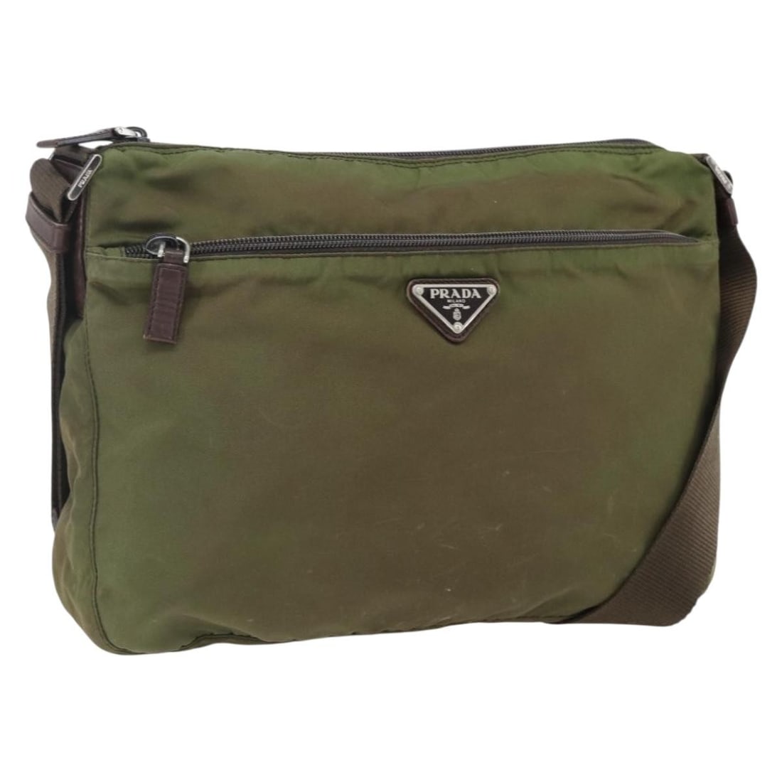 Prada Khaki Nylon Shoulder Purse with Silver Tone Accents: Prada Khaki Nylon Shoulder Purse with Silver Tone Accents This is a PRADA shoulder bag crafted from khaki nylon with silver-tone accents. Made in Italy, the bag features a spacious main compartment an