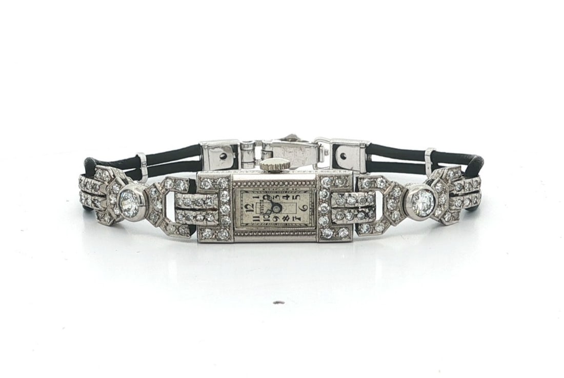 Invicta Art Deco Platinum Diamond Manual Women's Wristwatch with Black Leather Band: Invicta Art Deco Platinum Diamond Manual Women's Wristwatch with Black Leather Band This antique Art Deco wristwatch features a hand-engraved solid platinum case adorned with both Old European cut and