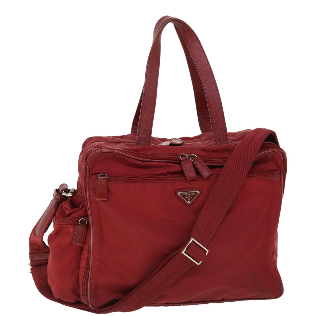 Prada Red Nylon Boston Bag with Shoulder Strap Italy: Prada Red Nylon Boston Bag with Shoulder Strap Italy This PRADA Boston Bag is crafted from durable red nylon and features a versatile 2-way design, allowing it to be carried by hand or with the detach