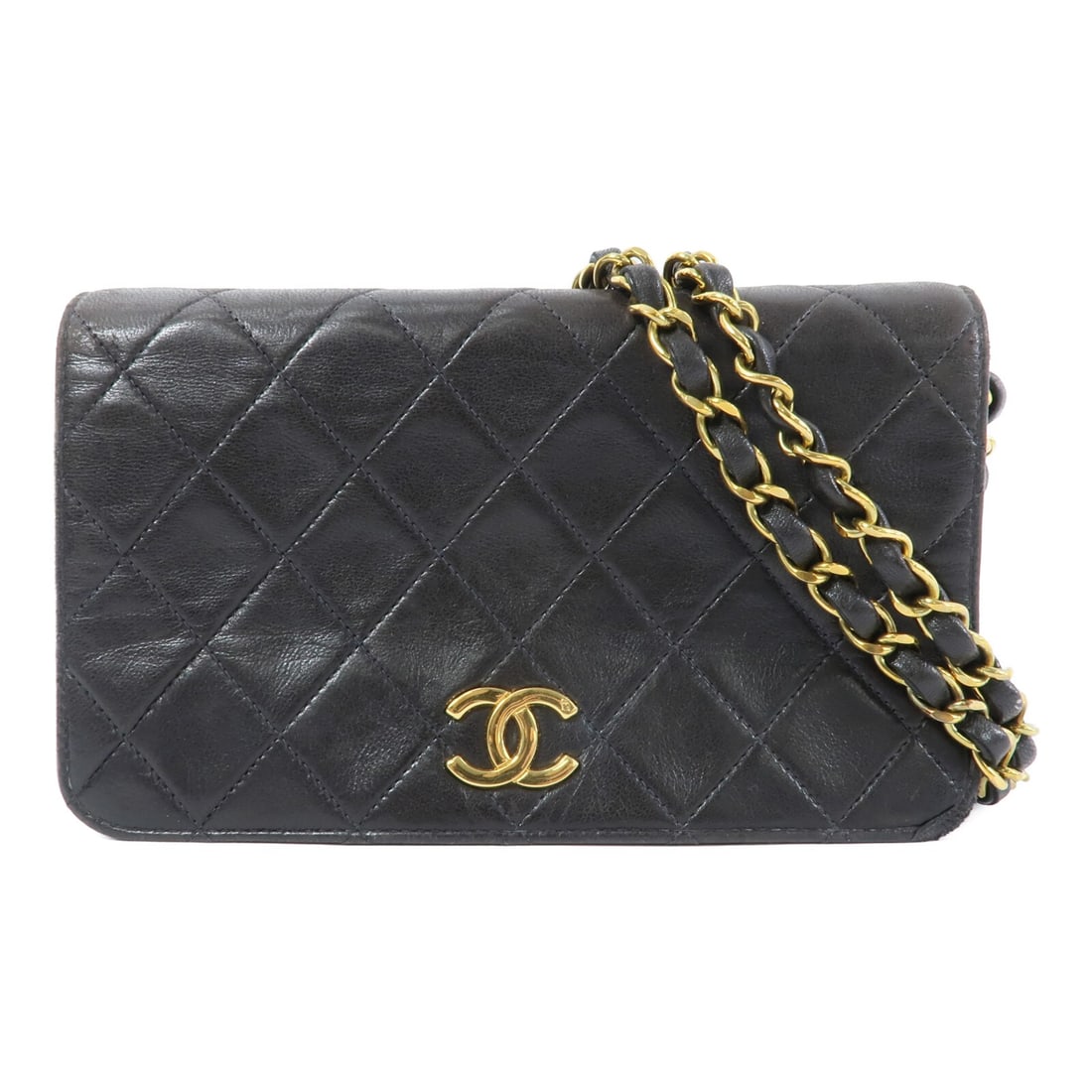 CHANEL Vintage Lambskin Black Shoulder Bag CC GHW: CHANEL Vintage Lambskin Black Shoulder Bag CC GHW This vintage CHANEL shoulder bag is crafted from luxurious black lambskin leather and features the iconic CC design with gold-tone hardware. Designed 