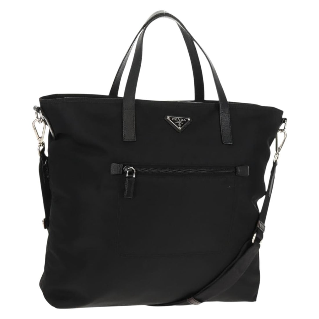 Prada Black Nylon Two Way Tote With Silver Accents and Shoulder Strap: Prada Black Nylon Two Way Tote With Silver Accents and Shoulder Strap This Prada tote bag features a 2-way design crafted from black nylon with silver-tone accents. It includes both a handle and a det