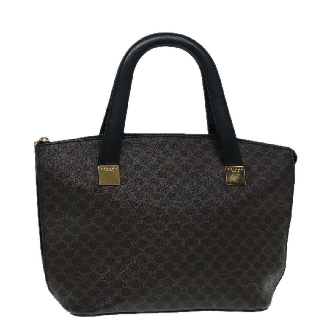 Celine Macadam Black PVC Leather Handbag with Gold Tone Accents: Celine Macadam Black PVC Leather Handbag with Gold Tone Accents This CELINE Macadam hand bag features a classic black and gold color scheme crafted from PVC leather and Macadam canvas. Designed for wo