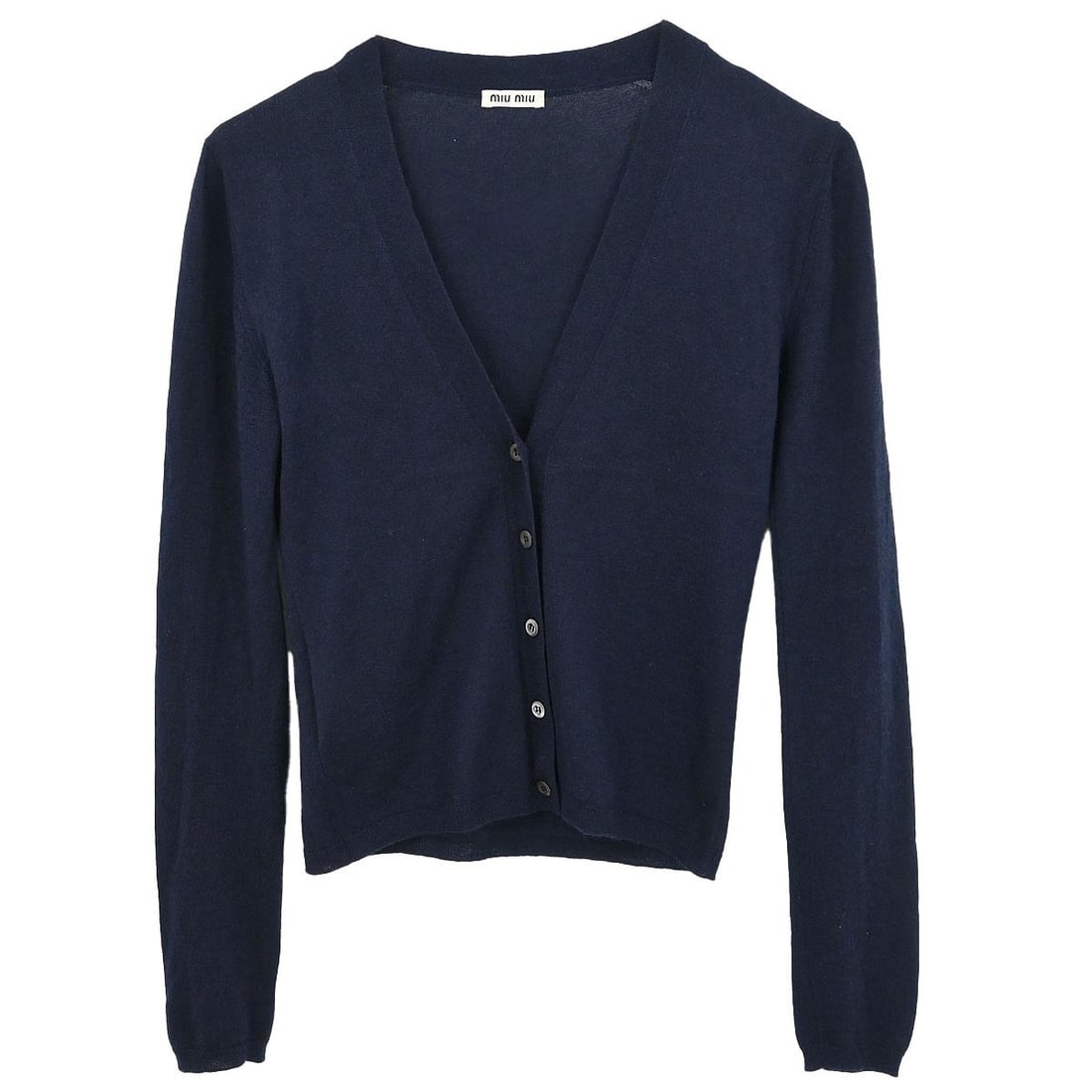 Miu Miu Navy Cardigan 70% Cashmere 30% Silk Vintage AMM1 2010: Miu Miu Navy Cardigan 70% Cashmere 30% Silk Vintage AMM1 2010 This exquisite Miu Miu cardigan in a classic navy color is perfect for casual occasions. Crafted from a luxurious blend of 70% cashmere an